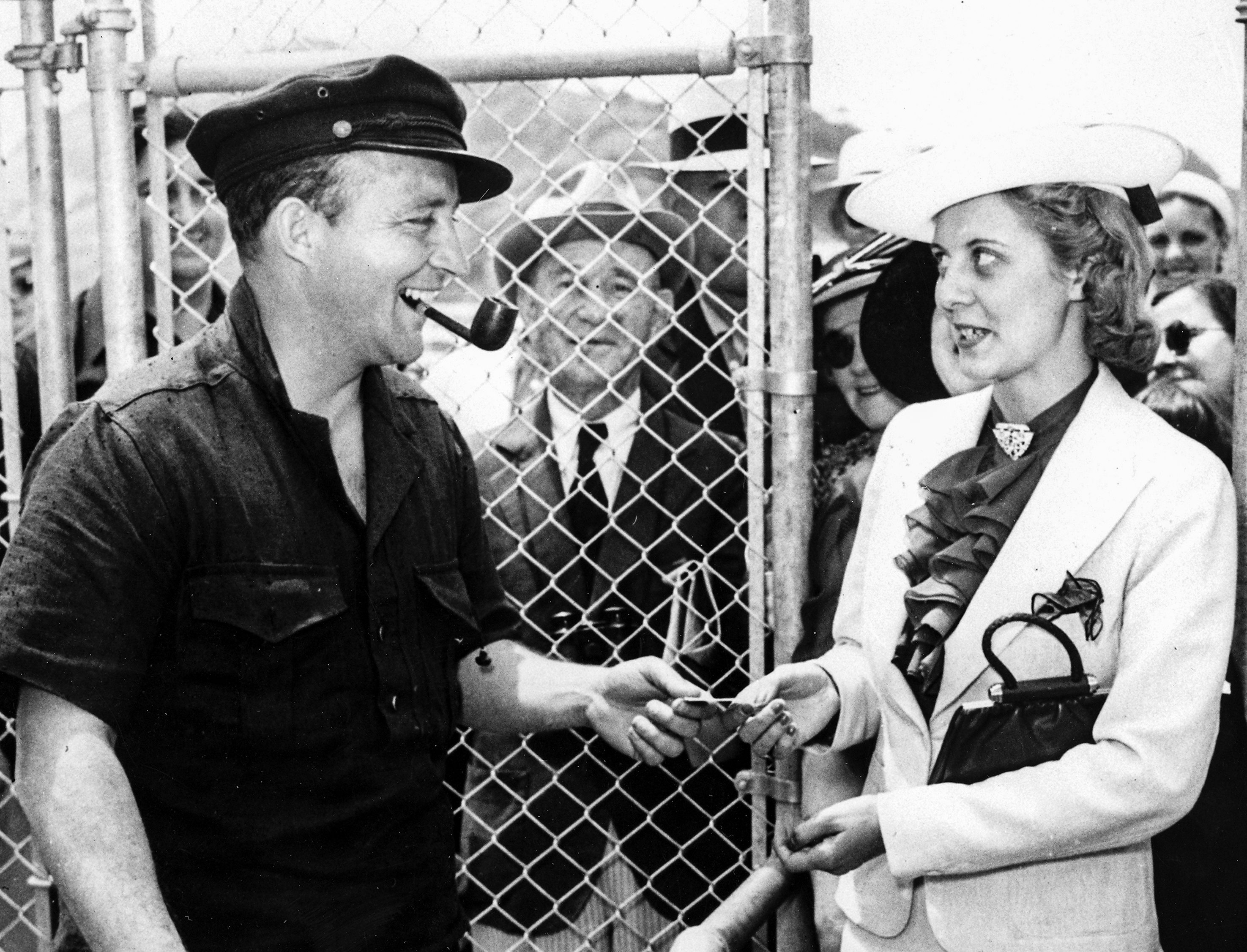 Bing Crosby welcomes first patron to Del Mar.